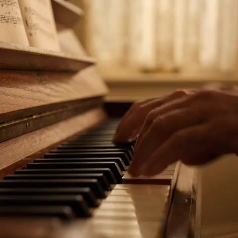 Elderly Man Playing Piano with Dynamic Camera Movement