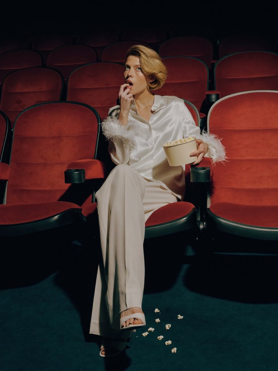 Elegant Fashion Editorial in a Dark Movie Theater